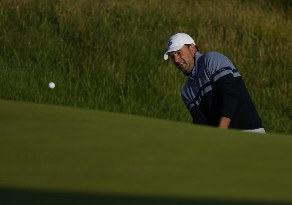 England's Richard Bland chips onto the 2nd green during the first round British Open Golf Championship at Royal St George's golf course Sandwich, England, Thursday, July 15, 2021. (AP Photo/Alastair Grant)