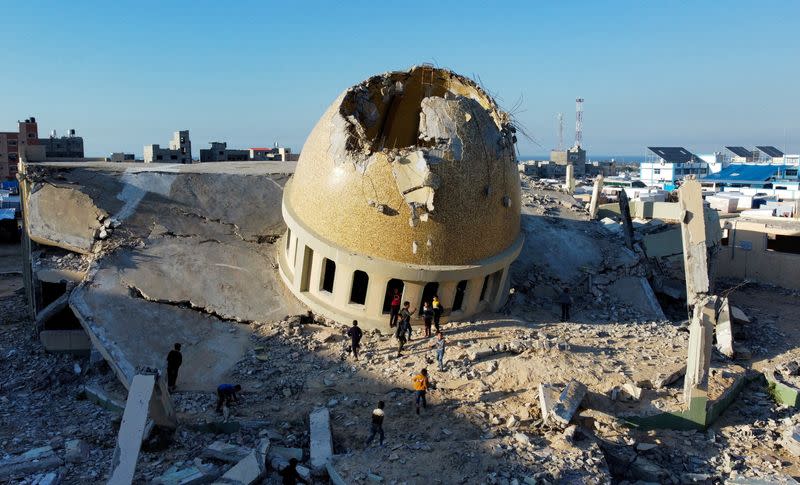 A mosque destroyed in Israeli strikes during the conflict lies in ruin, in Khan Younis