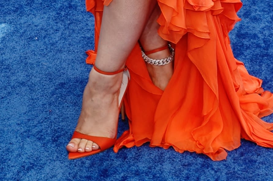 A closer look at the bright orange open-toe shoes worn by Ice Spice at the 2024 BET Awards in Los Angeles