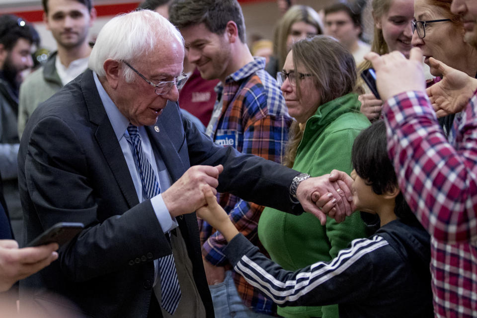Democratic presidential candidate Sen. Bernie Sanders, I-Vt., greets members of the audience after speaking at a campaign stop at Stevens High School, Sunday, Feb. 9, 2020, in Claremont, N.H. (AP Photo/Andrew Harnik)