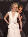 <p>The girlfriends got silly on the red carpet at the Governors Awards, with J.Law photobombing her pal while she posed for the photo pool. (Photo: Valerie Macon/AFP/Getty Images) </p>