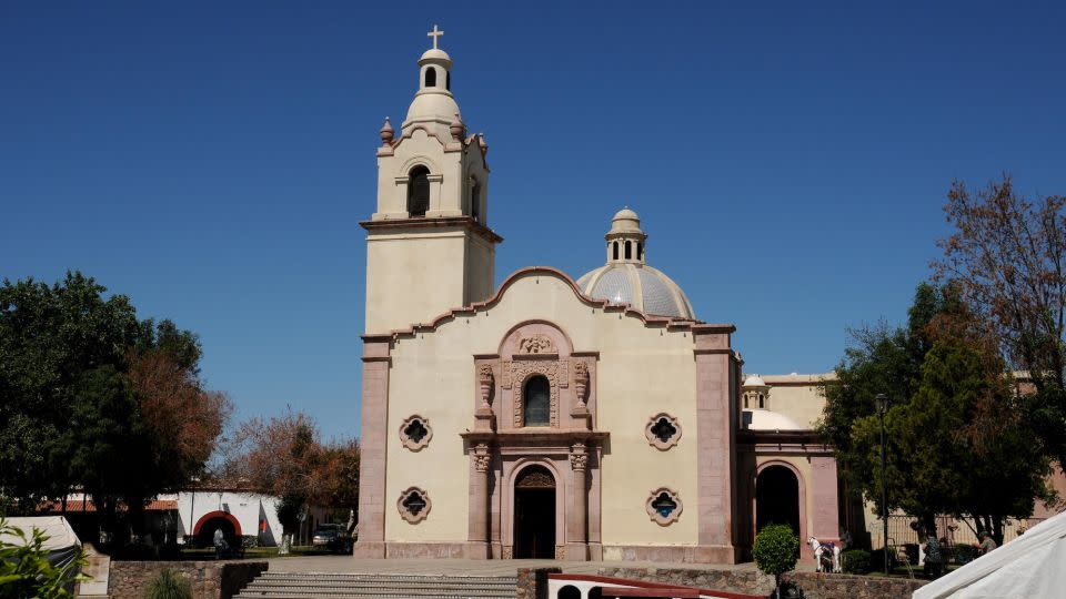 A historic mission in the town of Magdalena de Kino, in Sonora, Mexico. The town draws thousands of pilgrims who come to celebrate Saint Francis Xavier and Father Kino, a Jesuit priest who founded missions in the region. But over the years some residents, like Manuel, have also left the town looking for work. - Norma Jean Gargasz/Alamy