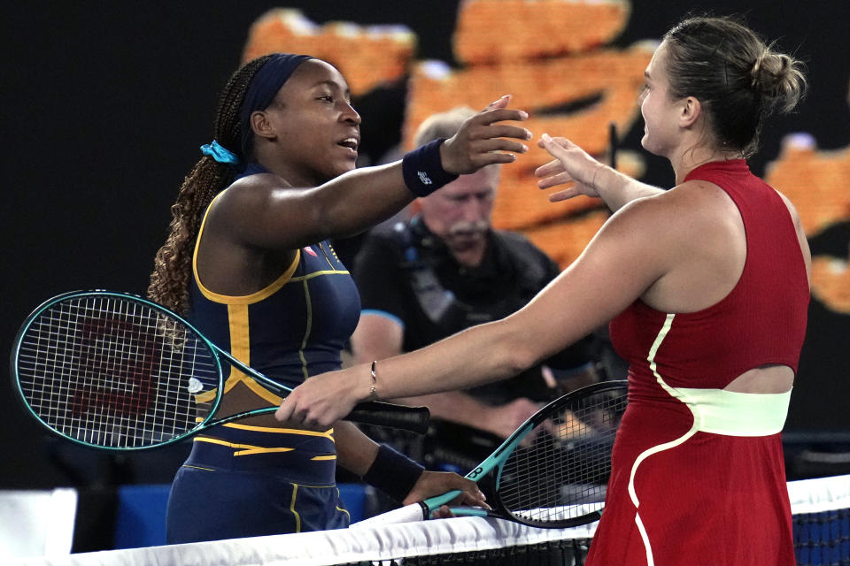 Coco Gauff, left, of the U.S. congratulates Aryna Sabalenka of Belarus following their semifinal match at the Australian Open tennis championships at Melbourne Park, Melbourne, Australia, Thursday, Jan. 25, 2024. (AP Photo/Andy Wong)