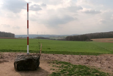 A red-white pole, marks the new geographical centre of the European Union in case of Brexit in Gadheim, Germany, April 8, 2019. The town of less than 100 residents prepares to become the geographical centre of the European Union after Brexit. Meanwhile, the EU's current geoegraphical centre, Westerngrund, just 60 kilometres away, will lose its title. REUTERS/Tilman Blasshofer