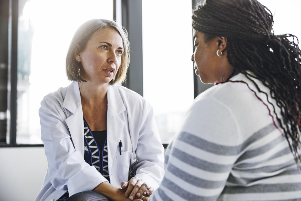 Woman at doctors about rare disease. (Getty Images)