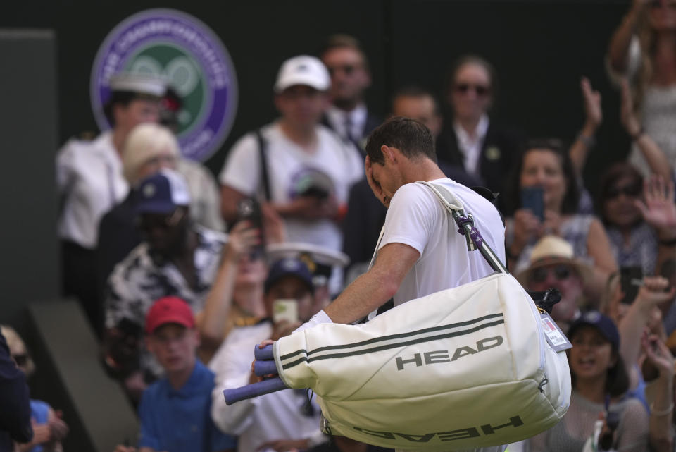 Britain's Andy Murray leaves the court after losing to Stefanos Tsitsipas of Greece in a men's singles match on day five of the Wimbledon tennis championships in London, Friday, July 7, 2023. (AP Photo/Alberto Pezzali)