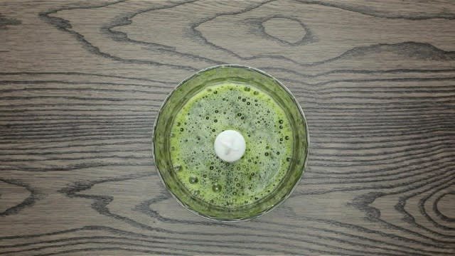 Blended pandan juice in a food processor