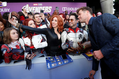 Cast member Chris Hemsworth poses with fans on the red carpet at the world premiere of the film "The Avengers: Endgame" in Los Angeles, California, April 22, 2019. REUTERS/Mario Anzuoni