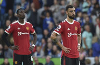 Manchester United's Bruno Fernandes, right, and Manchester United's Paul Pogba react after Leicester's Patson Daka scored his side's fourth goal during the English Premier League soccer match between Leicester City and Manchester United at King Power stadium in Leicester, England, Saturday, Oct. 16, 2021. (AP Photo/Rui Vieira)