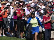 Paula Reto, of South Africa, acknowledges the crowd as she approaches the 18th green during the Canadian Pacific Women's Open golf tournament in Ottawa, on Sunday, Aug. 28, 2022. (Adrian Wyld/The Canadian Press via AP)