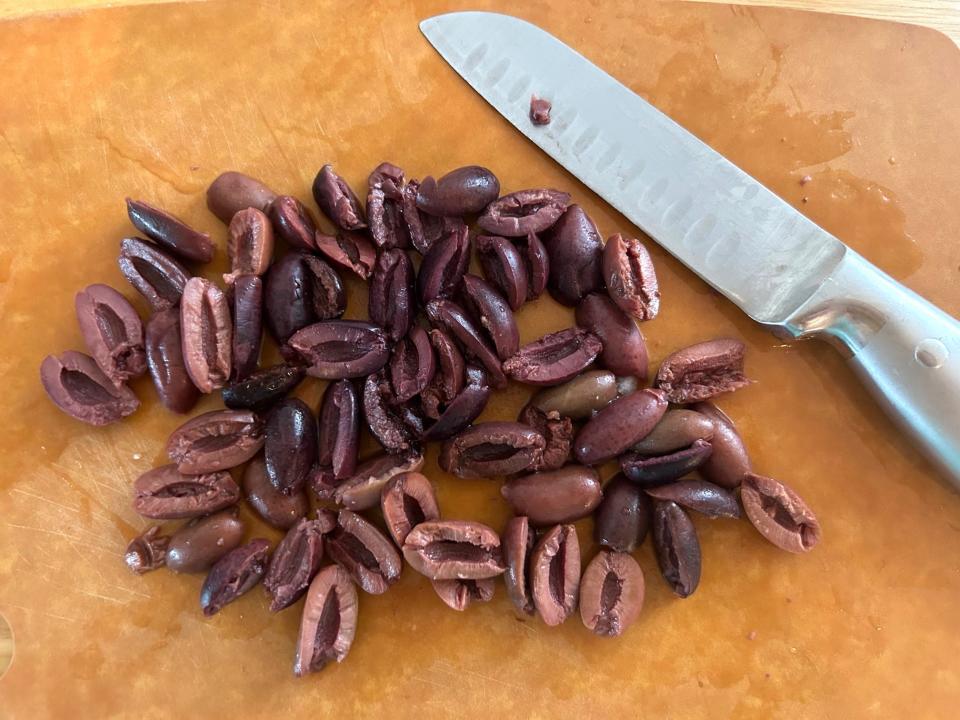 Cutting olives for Ina Garten's Greek Orzo Salad