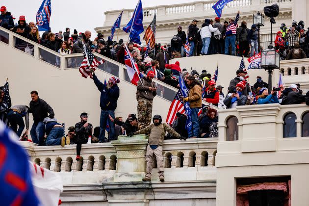 Donald Trump supporters storm the U.S. Capitol on Jan. 6, 2021, after Trump claimed the election was stolen. (Photo: Samuel Corum via Getty Images)