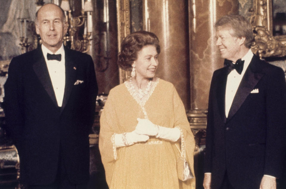 FILE - In this file photo dated May 1977, U.S. President Jimmy Carter, right, and Queen Elizabeth II stand with French President Valery Giscard d'Estaing, at Buckingham Palace in London. (AP Photo, File)