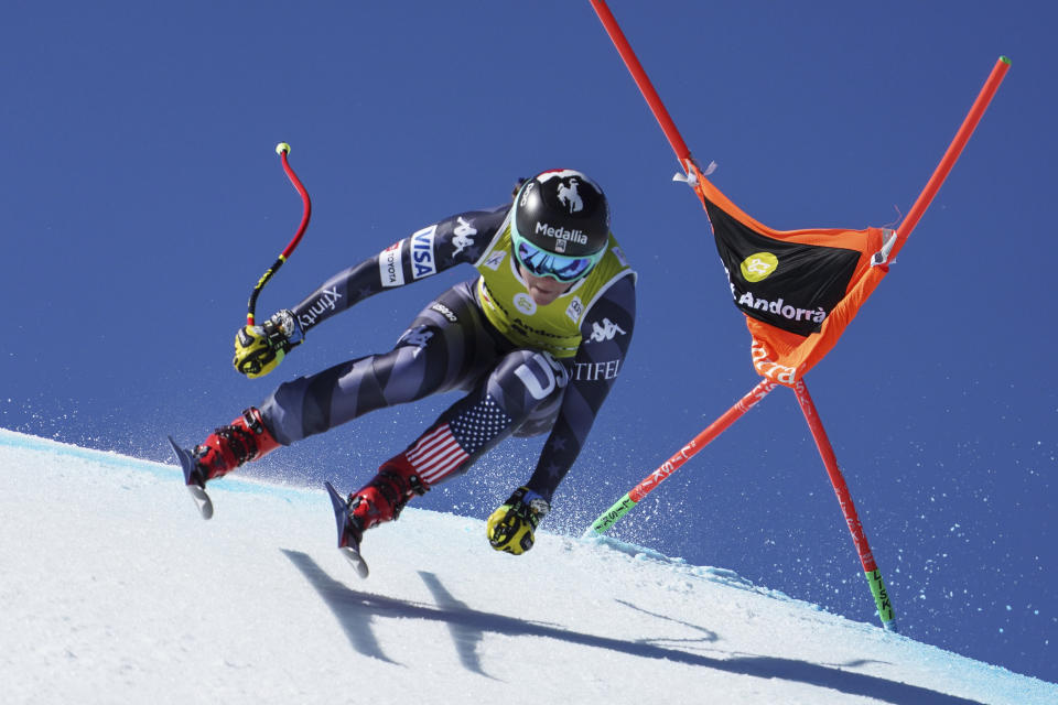 FILE - United States' Breezy Johnson speeds down the course during an alpine ski, women's World Cup downhill in Soldeu, Andorra, Wednesday, March 15, 2023. Johnson is under investigation by the U.S. Anti-Doping Agency and says she will not race during the case, which could lead to a two-year ban. “Out of respect for my fellow racers, I have decided not to compete until the matter is resolved," Johnson said in a statement on social media Saturday, Dec. 9, 2023, after she did not start at a World Cup downhill in St. Moritz, Switzerland. (AP Photo/Giovanni Zenoni, File)