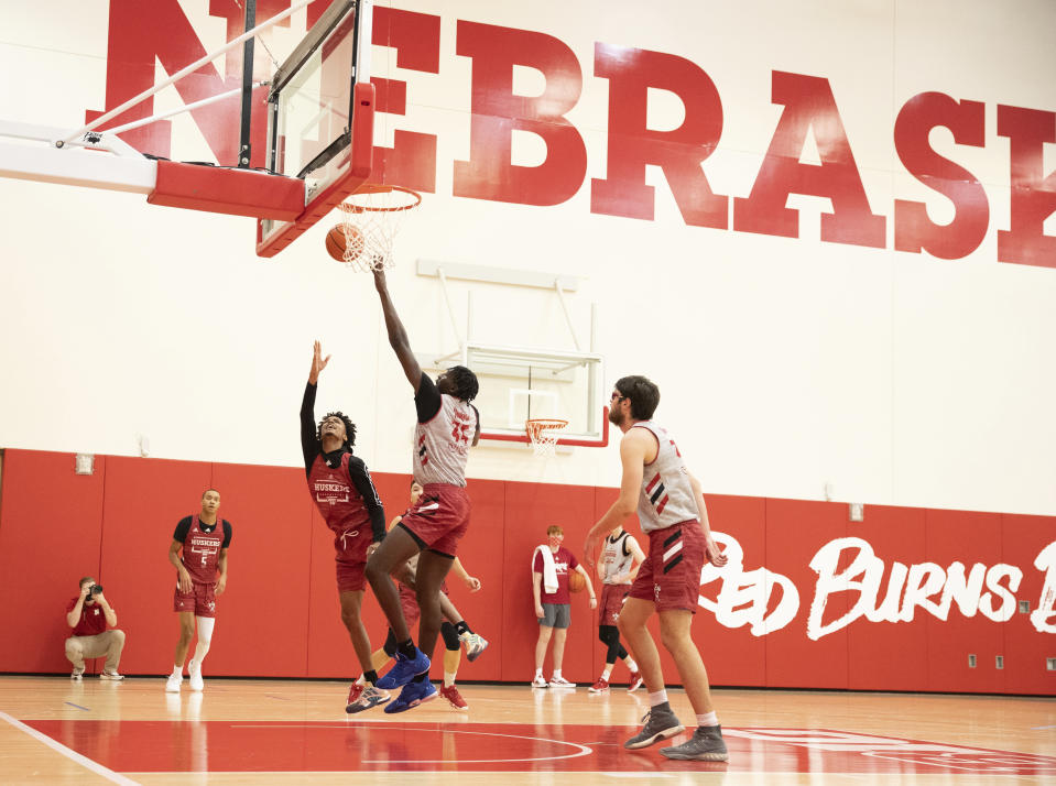 Alonzo Verge Jr., center left, takes a shot against Eduardo Andre (35) as teammates Bryce McGowens, left, and Wilhelm Breidenbach, right, watch from the outside during the Nebraska NCAA college basketball team's Pro Day workout Tuesday, Oct. 5, 2021, at the Hendricks Training Complex in Lincoln, Neb. (AP Photo/Rebecca S. Gratz)