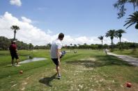 A FootGolfer kicks the ball off the second tee box at Largo Golf Course in Largo, Florida April 11, 2015. REUTERS/Scott Audette