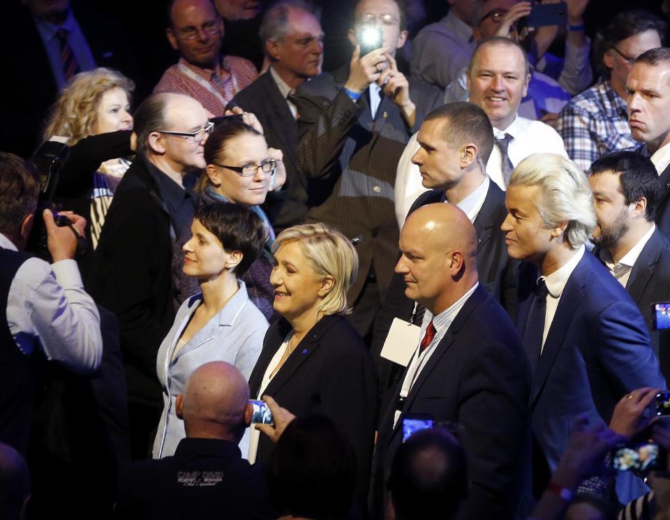 AfD (Alternative for Germany) chairwoman Frauke Petry, left, Far-right leader and candidate for next spring presidential elections Marine le Pen from France, second left, and Dutch populist anti-Islam lawmaker Geert Wilders, right, enter the room at the beginning of a meeting of European Nationalists in Koblenz, Germany, Saturday, Jan. 21, 2017. (AP Photo/Michael Probst)