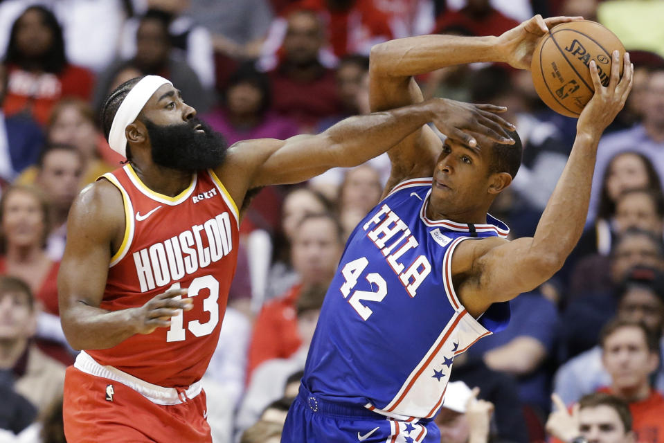 Philadelphia 76ers center Al Horford (42) looks to pass the ball as Houston Rockets guard James Harden defends during the first half of an NBA basketball game Friday, Jan. 3, 2020, in Houston. (AP Photo/Eric Christian Smith)