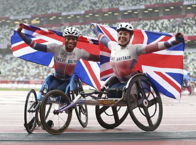 Hannah Cockroft (right) celebrates winning the women's 800m T34 final with Kare Adenegan, who claimed silver