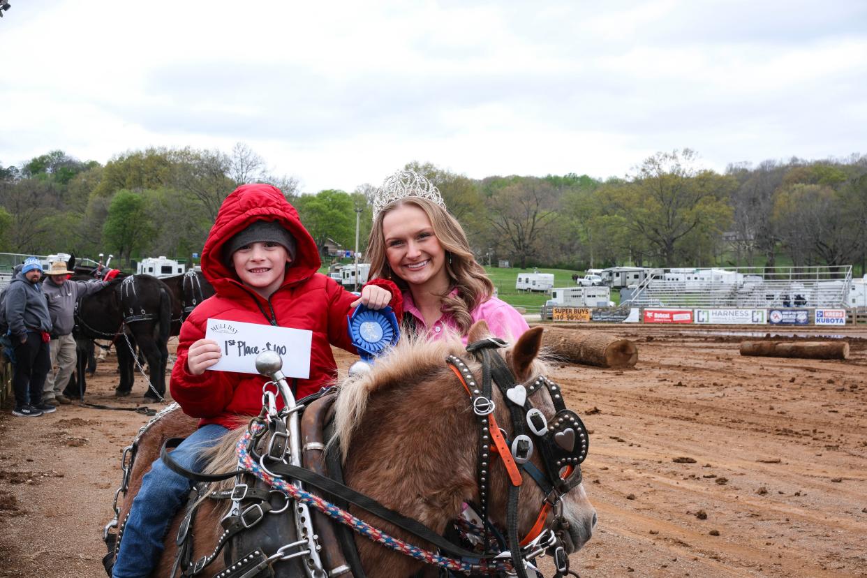 William Kid poses with Mule Day Queen Anisa Grimes as he wins First Place in the mini mule log-pulling competition at Maury County Park during the 50th Anniversary of Mule Day on April 4, 2024 in Columbia, Tenn.