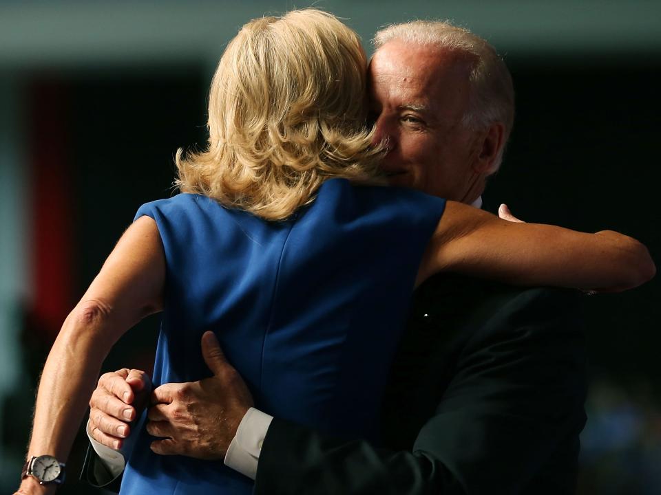 Joe Biden and Jill Biden hug on the campaign trail.