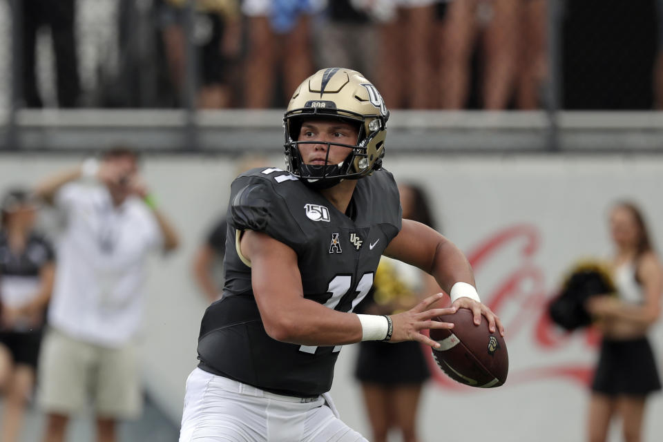 Central Florida quarterback Dillon Gabriel looks for a receiver against Stanford during the first half of an NCAA college football game, Saturday, Sept. 14, 2019, in Orlando, Fla. (AP Photo/John Raoux)