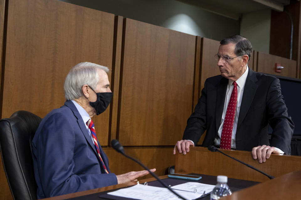 Sen. Rob Portman, R-Ohio, speaks to Sen. John Barrasso, R-Wyo., before a Senate Foreign Relations Committee meeting on Capitol Hill in Washington, Wednesday, Aug. 4, 2021. (AP Photo/Amanda Andrade-Rhoades)