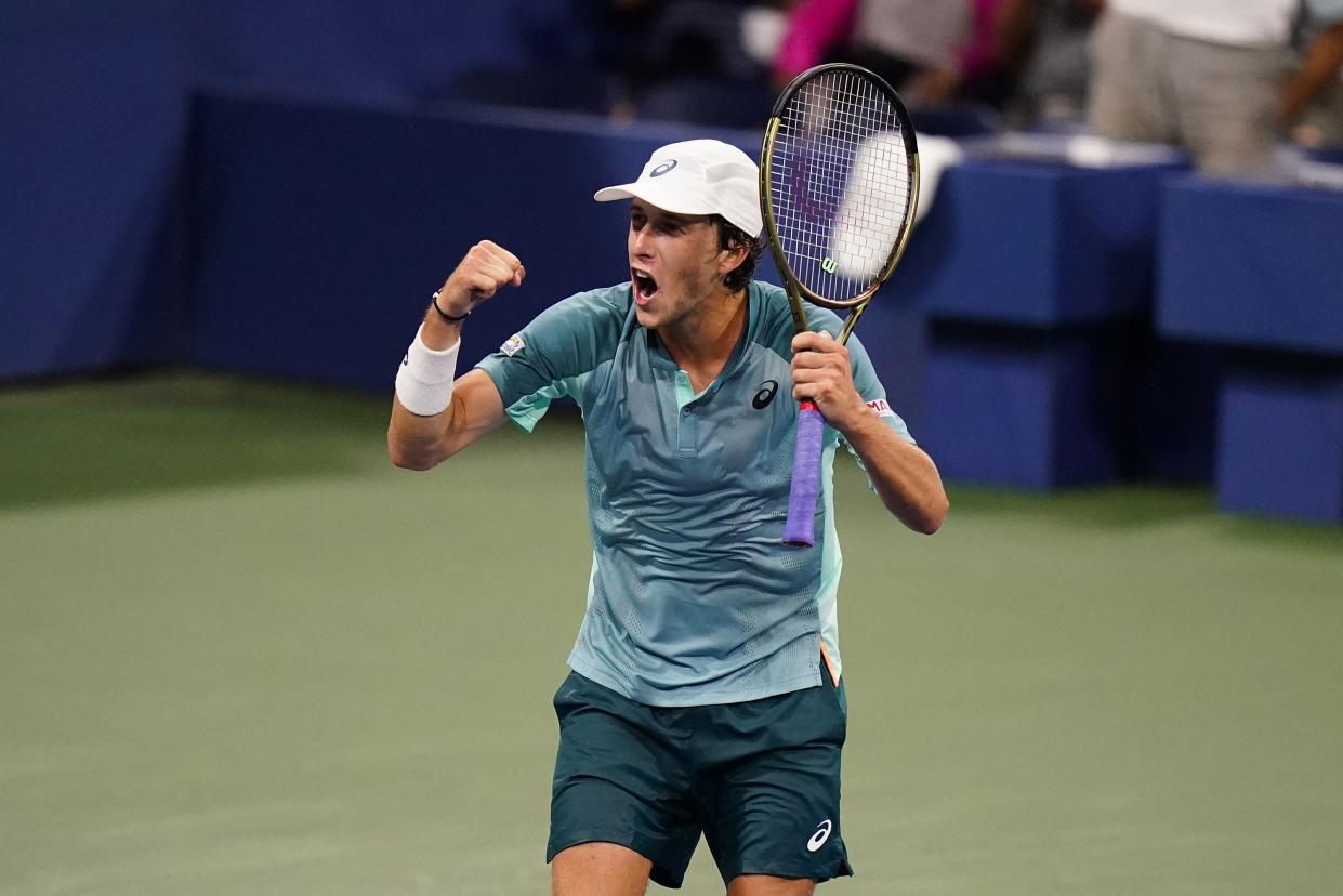 Brandon Holt, of the United States, reacts after defeating Taylor Fritz, of the United States, during the first round of the U.S. Open tennis championship on Monday, Aug. 29, 2022, in New York.