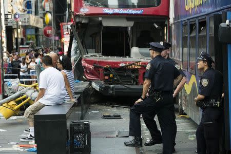 Double-decker tour buses collide in Times Square