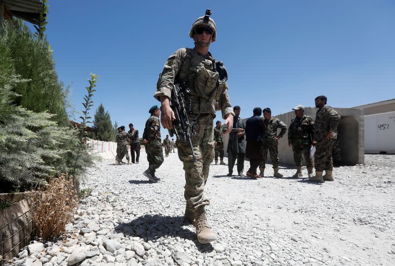 FILE PHOTO: An U.S. soldier keeps watch at an Afghan National Army (ANA) base in Logar province, Afghanistan