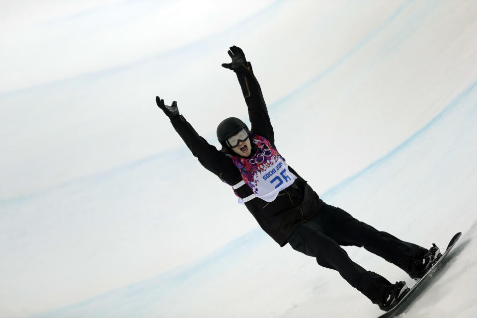 Switzerland's Iouri Podladtchikov celebrates after his second half pipe run during the men's snowboard halfpipe final at the Rosa Khutor Extreme Park, at the 2014 Winter Olympics, Tuesday, Feb. 11, 2014, in Krasnaya Polyana, Russia. Podladtchikov won the gold medal. (AP Photo/Andy Wong)