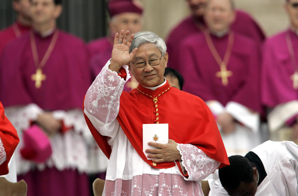 FILE - Monsignor Joseph Zen, bishop of Hong Kong, waves as he attends a consistory led by Pope Benedict XVI to elevate 15 new cardinals in St. Peter's Square at the Vatican, Friday, March 24, 2006. Zen will leave the southern Chinese city of Hong Kong this week to pay his respects to the late Pope Emeritus Benedict XVI in Vatican City, his secretary said on Tuesday, Jan. 3, 2023. (AP Photo/Pier Paolo Cito, File)