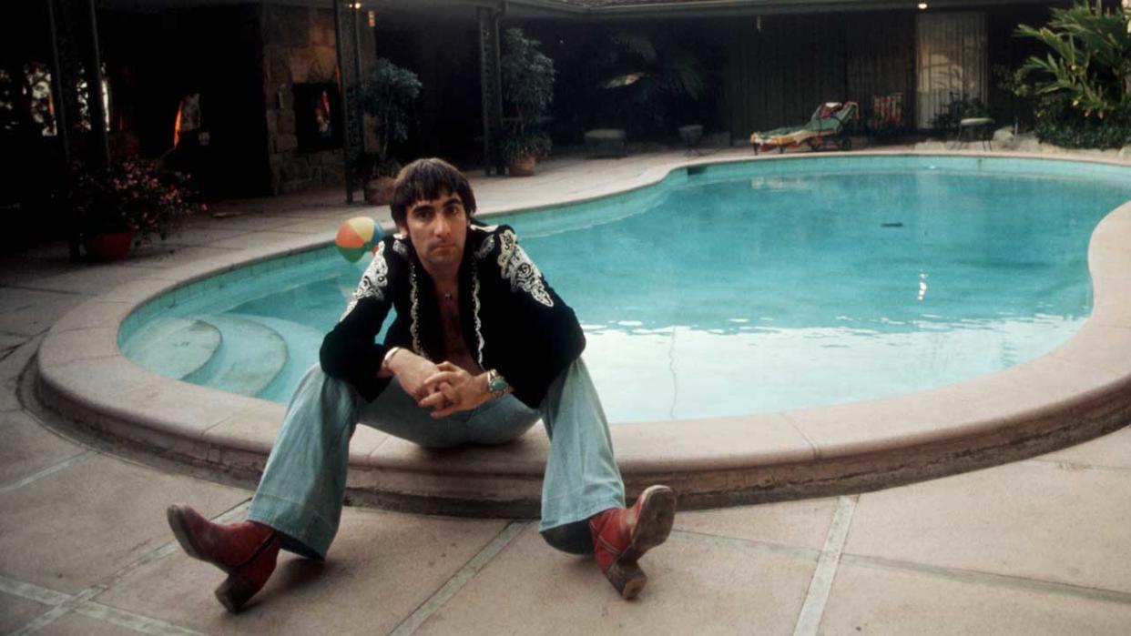  Keith Moon seated by his swimming pool in 1974 