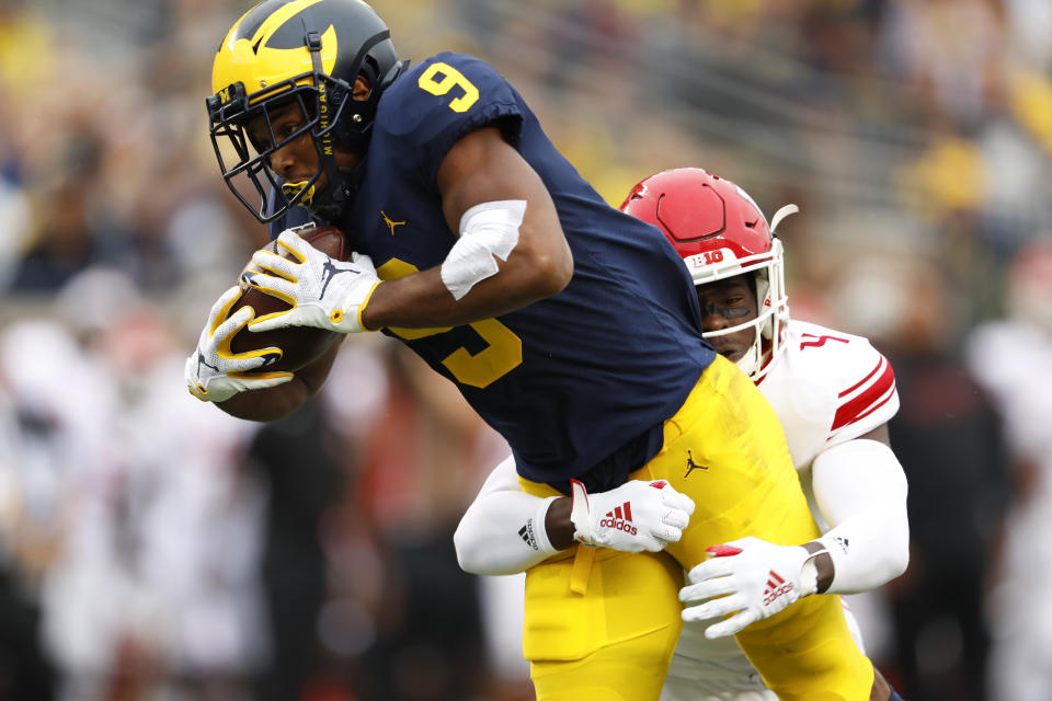 Michigan wide receiver Donovan Peoples-Jones (9) tries to break the tackle of Rutgers defensive back Tre Avery (4) in the first half of an NCAA college football game in Ann Arbor, Mich., Saturday, Sept. 28, 2019. (AP Photo/Paul Sancya)