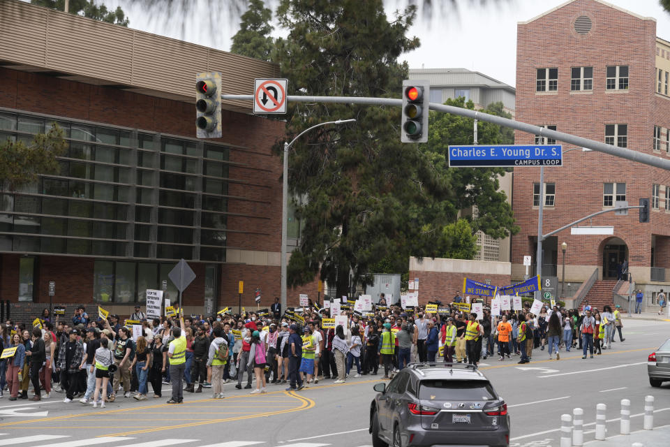 Demonstrators march on the UCLA campus Wednesday, June 12, 2024, in Los Angeles. The president of the University of Miami has been chosen to become the next chancellor of the University of California, Los Angeles, where the retiring incumbent is leaving a campus roiled by protests against Israel's war in Gaza. (AP Photo/Damian Dovarganes)