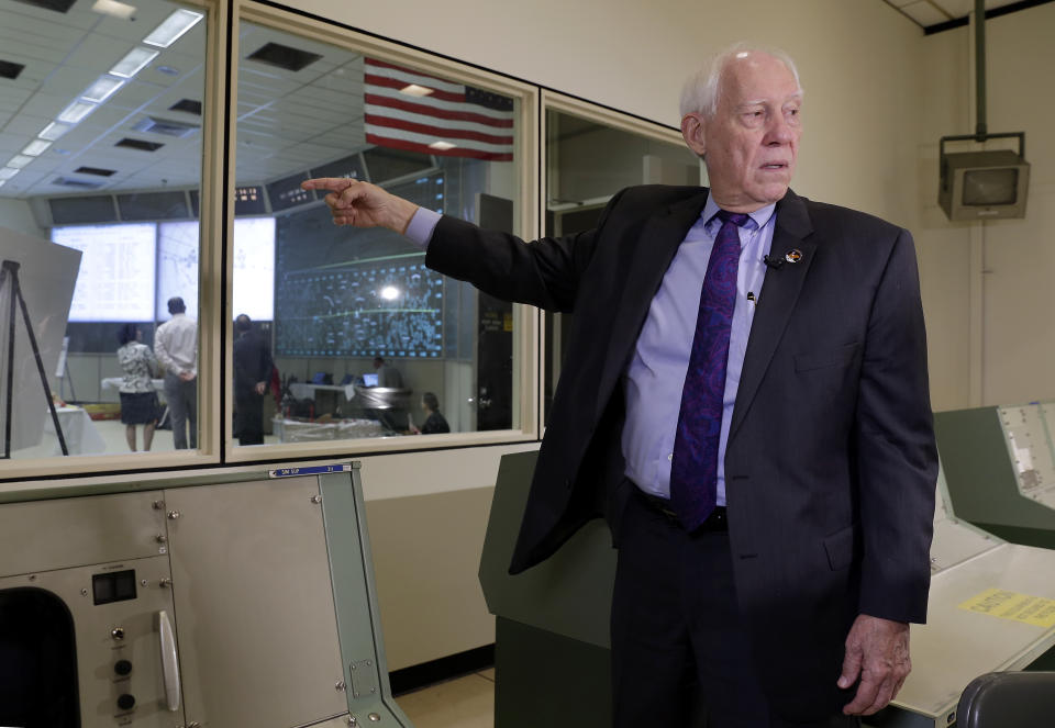 In this Monday, June 17, 2019 photo, Spencer Gardner, a flight activities officer during the Apollo missions, speaks during an interview inside the simulation room next to the mission control room which is under restoration at NASA's Johnson Space Center in Houston. Looking back, Gardner wishes he'd savored the moment of touchdown more. But he had a job to do and there was no time for reflection. (AP Photo/Michael Wyke)