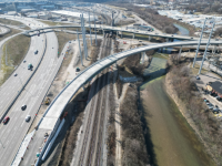 The new flyover bridge ramp from I-75 south to I-74 west rises 85 feet over Mill Creek at its highest point.