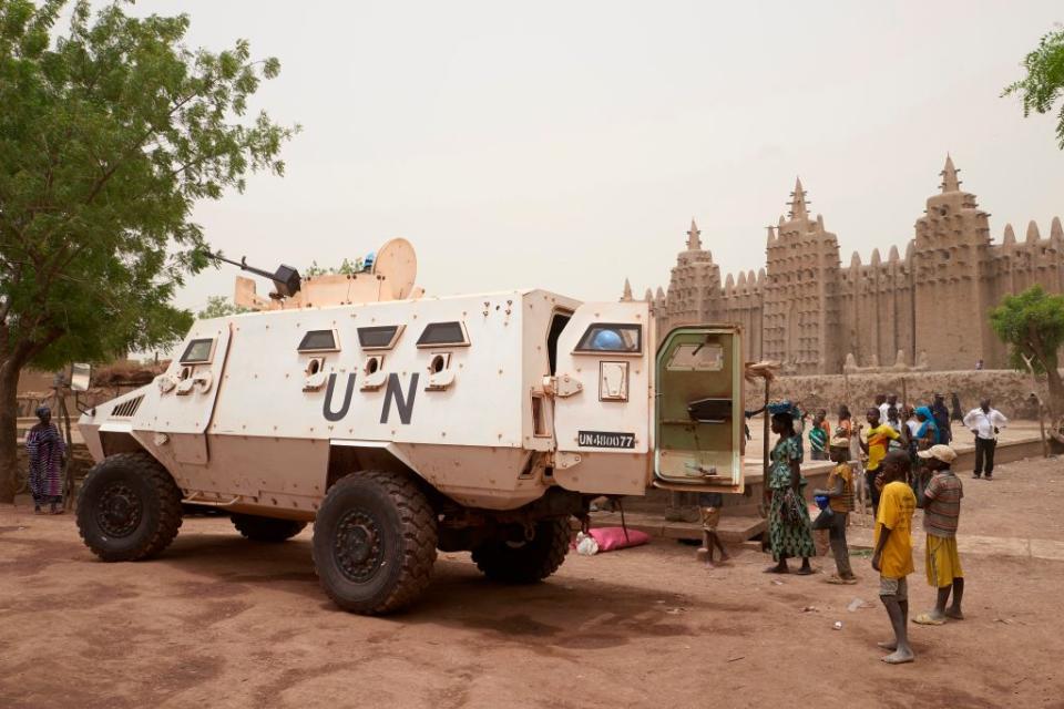 An armoured vehicle of the United Nations Multidimensional Integrated Stabilisation Mission in Mali (MINUSMA) patrols during the annual rendering of the Great Mosque of Djenne in central Mali, on April 28, 2019. | Michele Cattani—AFP/Getty Images