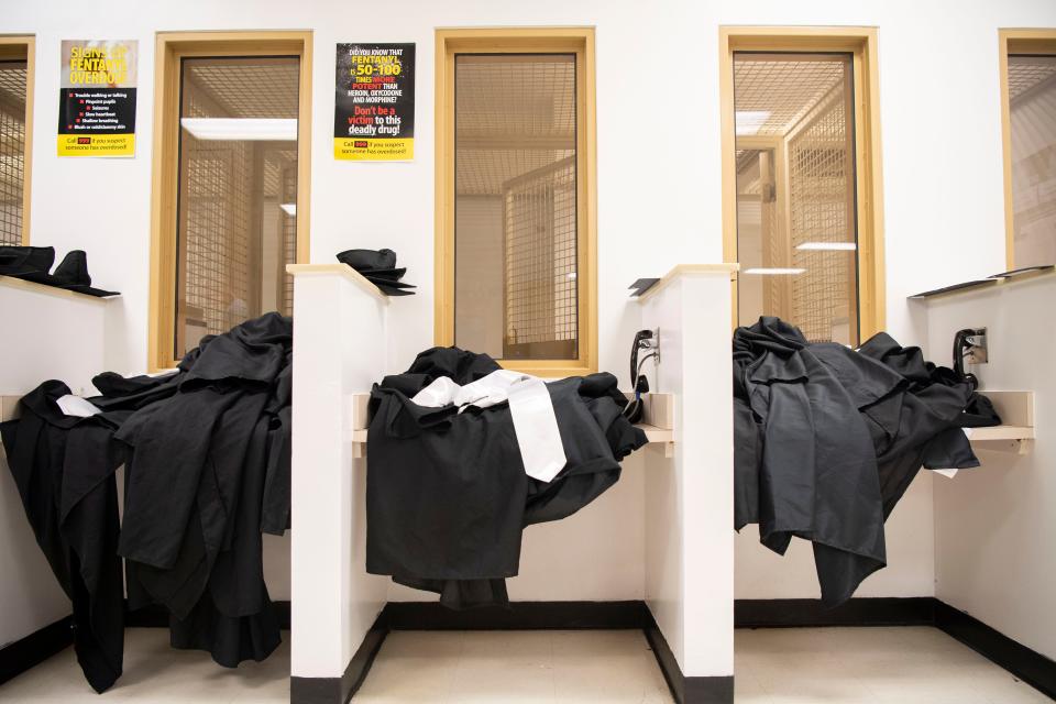Caps and Gowns are placed near the phones following a graduation ceremony of an addiction program at Trousdale Turner Correctional Center in Trousdale County, Tenn., Friday, May 10, 2024.