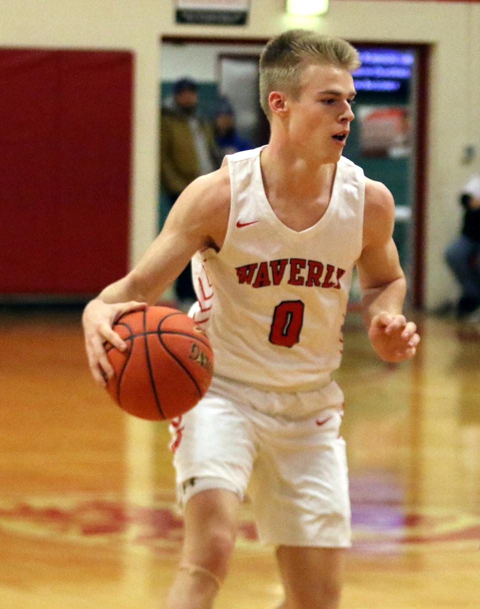 Waverly's Joey Tomasso handles the ball during a 69-53 win over Lansing in a Section 4 Class B boys basketball quarterfinal Feb. 24, 2023 at Waverly High School.