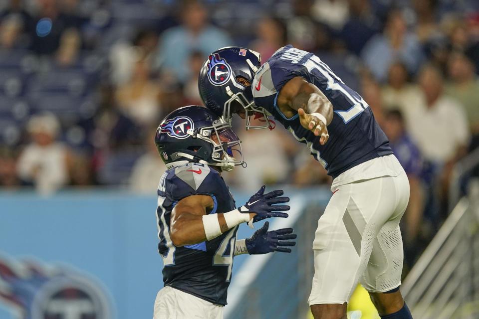 Tennessee Titans safety Matthew Jackson, right, and cornerback Anthony Kendall, celebrate after downing a punt near the goal line in the second half of an NFL preseason football game against the New England Patriots Friday, Aug. 25, 2023, in Nashville, Tenn. (AP Photo/George Walker IV)