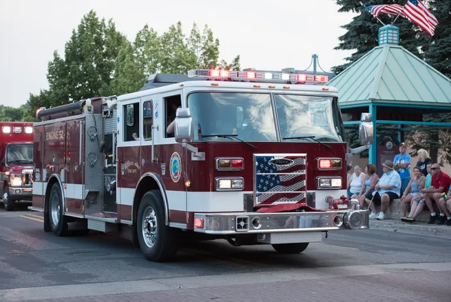 A photo of a firetruck making its way through the 2018 Sault St. Marie Fourth of July parade.