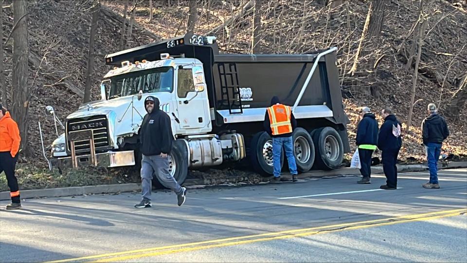 A dump truck and a pickup truck crashed around 8:40 a.m. at Washington Boulevard and Allegheny River Boulevard in the city's Highland Park neighborhood.