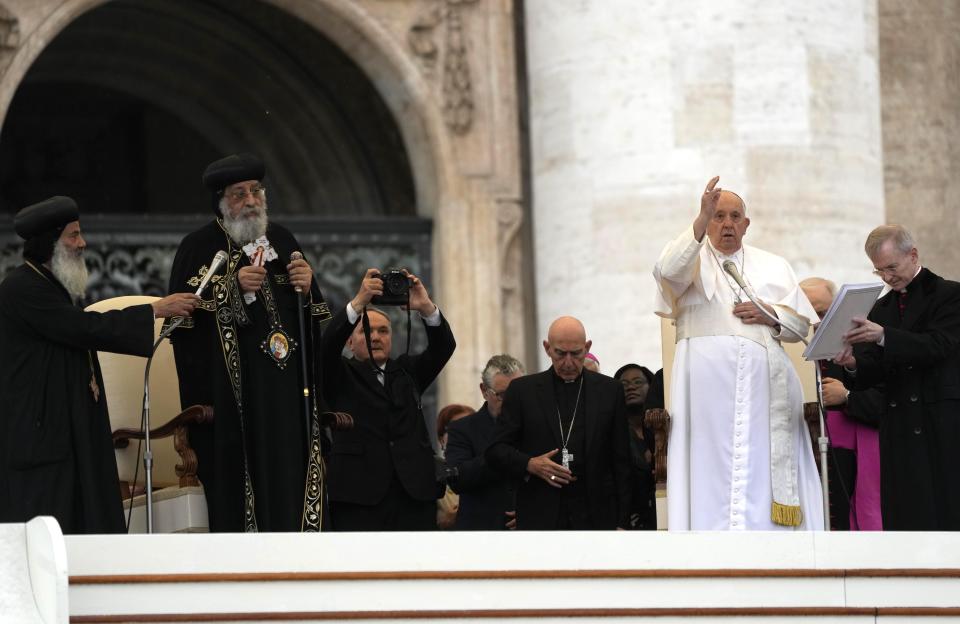Pope Francis, second right, and the Patriarch Tawadros II of Alexandria deliver a joint blessing during the weekly general audience in St. Peter's Square at The Vatican, Wednesday, May 10, 2023. Pope Francis and the Orthodox Coptic pope have delivered a joint blessing from St. Peter's Square, a significant ecumenical gesture to commemorate the 50th anniversary of a historic meeting of their predecessors. (AP Photo/Alessandra Tarantino)