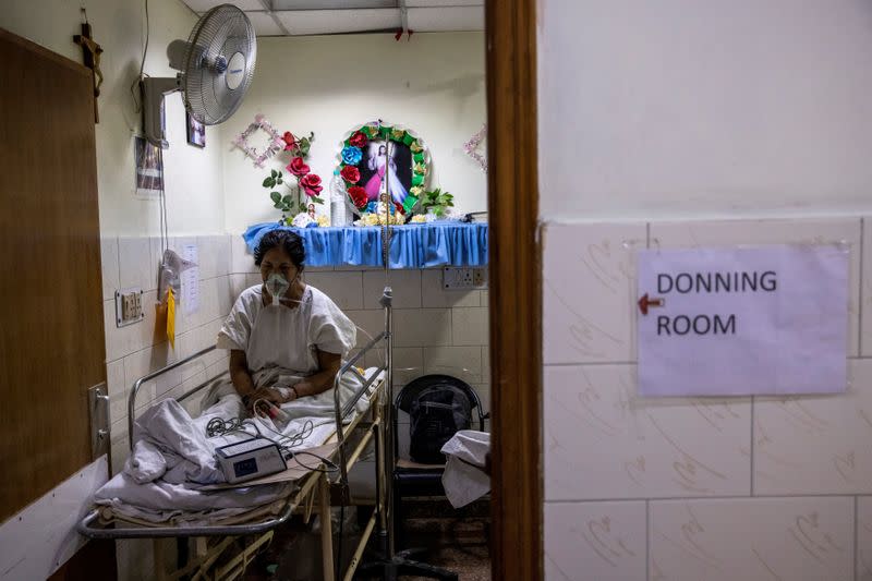 The Wider Image: As COVID ravages India, a 26-year-old doctor decides who lives and who dies