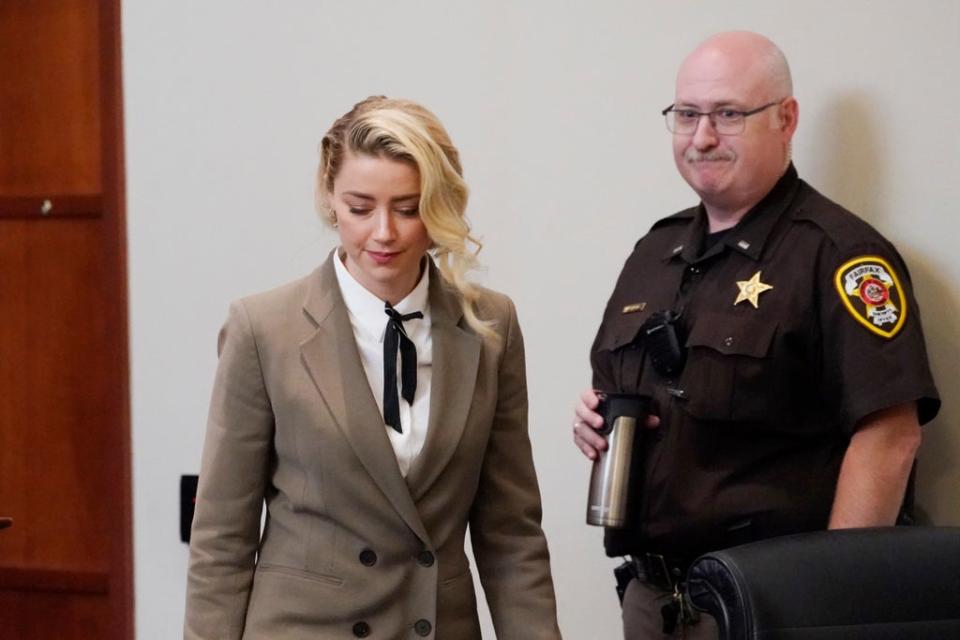 Actor Amber Heard arrives into the courtroom after a break at the Fairfax County Circuit Courthouse in Fairfax on 23 May (AP)