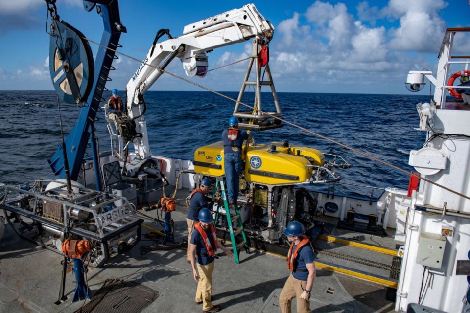 Scientists aboard the Exploration Vessel Nautilus launch the ROV Hercules to search for meteorite fragments off the coast of Washington state. <cite>Susan Poulton/Ocean Exploration Trust</cite>