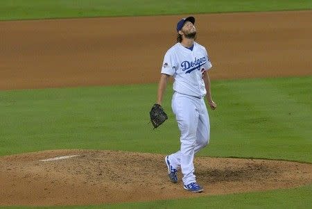 October 9, 2015; Los Angeles, CA, USA; Los Angeles Dodgers starting pitcher Clayton Kershaw (22) reacts after loading the bases in the seventh inning against the New York Mets in game one of the NLDS at Dodger Stadium. Mandatory Credit: Jayne Kamin-Oncea-USA TODAY Sports