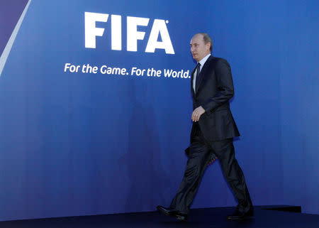 FILE PHOTO: Russia's Prime Minister Vladimir Putin arrives for a news conference after the announcement that Russia will host the FIFA World Cup 2018 in Zurich December 2, 2010. REUTERS/Arnd Wiegmann/File Photo