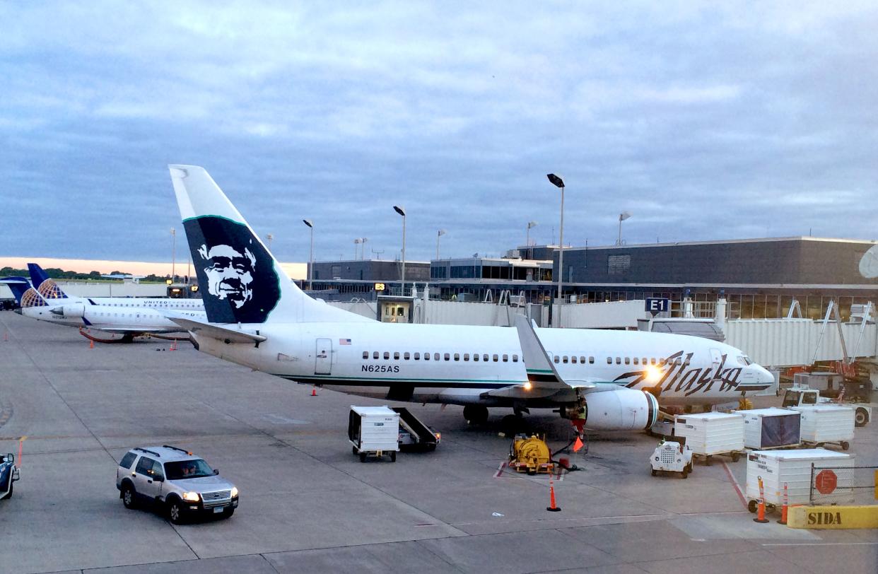 An Alaska Airlines plane at a terminal. (Photo: Karen Bleier/AFP/Getty Images)